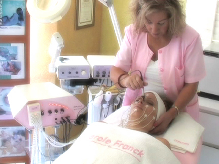 Gohar performing a facial treatment